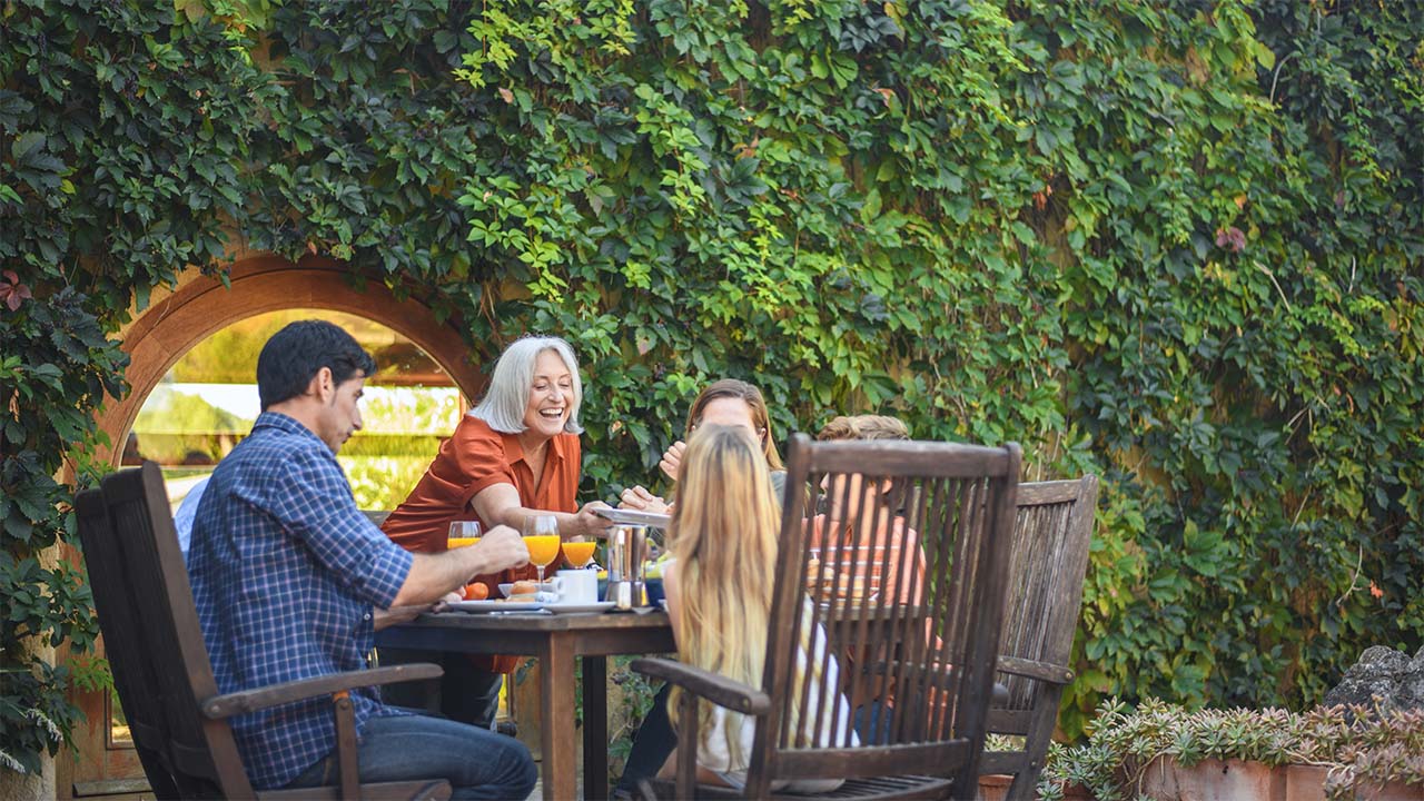 family sitting in private garden